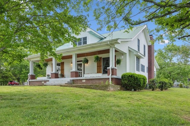 1494 Grant Rd, Watertown, TN 37184 - view of front of home with covered porch, a chimney, metal roof, and a front lawn