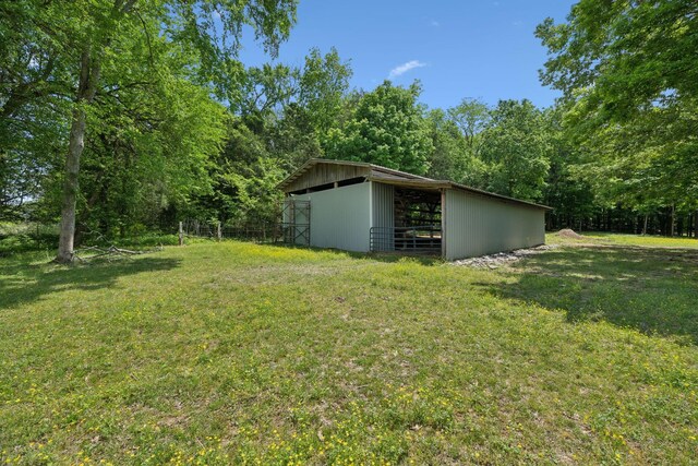 1494 Grant Rd, Watertown, TN 37184 - view of yard with a forest view, a pole building, and an outdoor structure