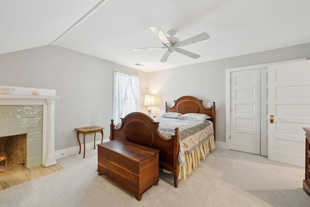 1494 Grant Rd, Watertown, TN 37184 - bedroom featuring light carpet, visible vents, baseboards, a tile fireplace, and vaulted ceiling