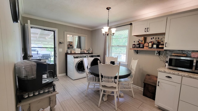 4471 Seminary Rd, Smyrna, TN 37167 - dining room with crown molding, independent washer and dryer, a chandelier, and baseboards