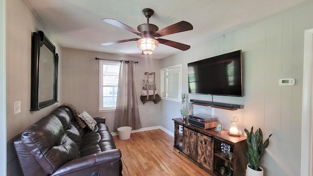 4471 Seminary Rd, Smyrna, TN 37167 - living room featuring a textured ceiling, light wood-style floors, ceiling fan, and baseboards