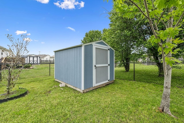 view of shed with a fenced backyard