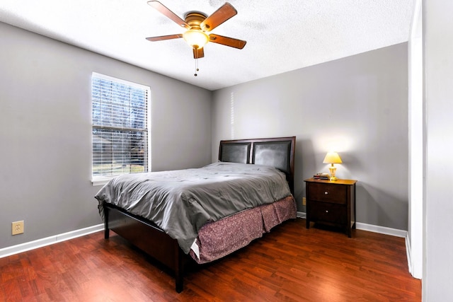 bedroom with wood finished floors, baseboards, and ceiling fan