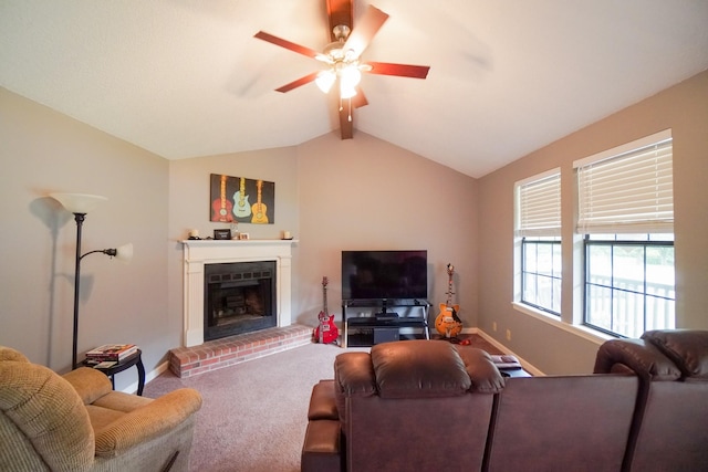 carpeted living room featuring ceiling fan, baseboards, and a fireplace
