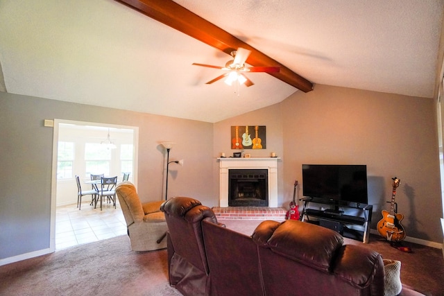 living room with a fireplace, carpet floors, a ceiling fan, and baseboards