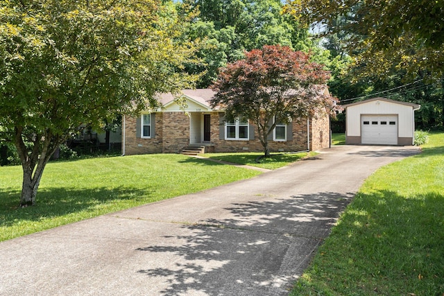 102 Forrest Hills Dr, Dickson, TN 37055 - view of front of property with an outbuilding, a garage, asphalt driveway, a front lawn, and brick siding