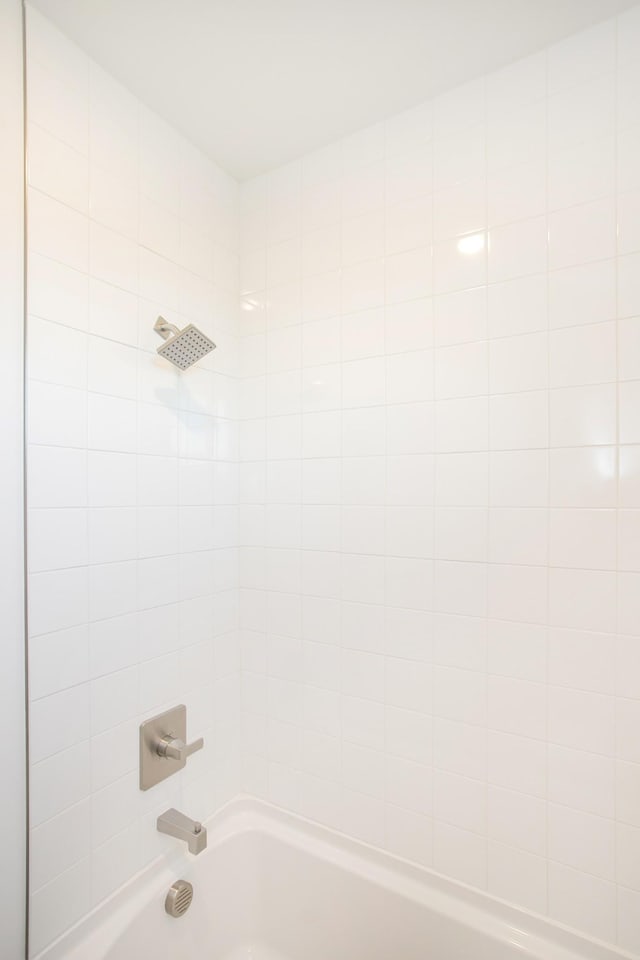 full bath featuring washtub / shower combination