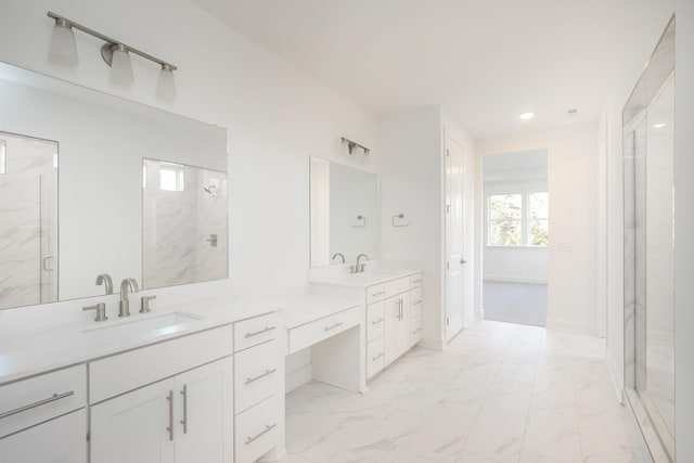 bathroom featuring vanity, baseboards, marble finish floor, and a marble finish shower