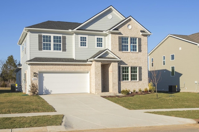 traditional home with a front yard, driveway, an attached garage, and central AC unit