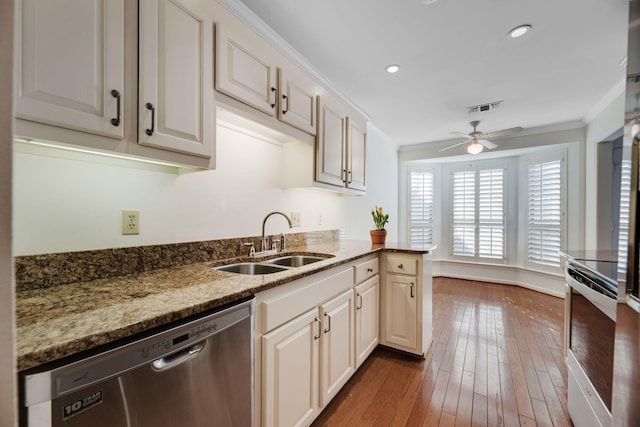 1202 General George Patton Rd, Nashville, TN 37221 - kitchen with stainless steel appliances, ornamental molding, a sink, visible vents, and a ceiling fan