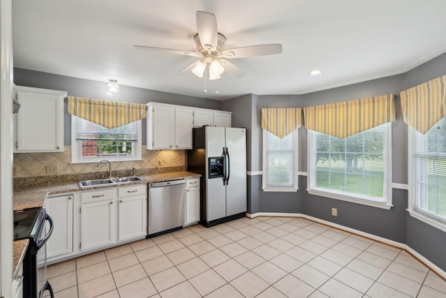 kitchen featuring ceiling fan, dishwasher, a sink, black range with electric cooktop, and refrigerator with ice dispenser