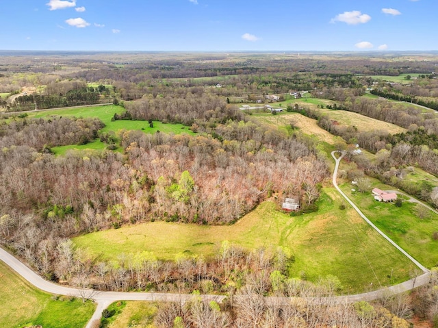 drone / aerial view featuring a forest view