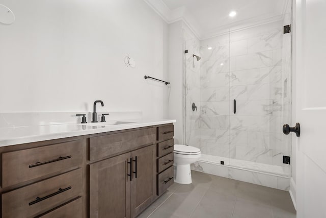 bathroom with a shower stall, crown molding, toilet, vanity, and tile patterned flooring