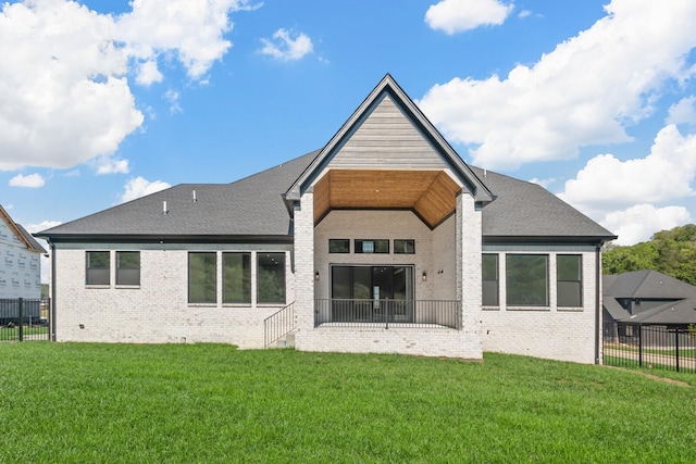 back of property featuring fence, a yard, a patio, and brick siding