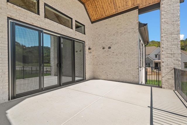 view of patio featuring a balcony