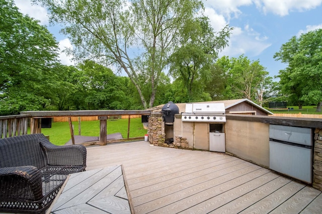 106 Windellwood Cir, Smyrna, TN 37167 - wooden terrace featuring an outdoor kitchen, a yard, a grill, and view of scattered trees