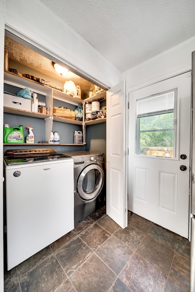 106 Windellwood Cir, Smyrna, TN 37167 - washroom with washer and clothes dryer, a textured ceiling, and dark stone finish flooring