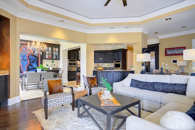 140 Lake Shore Ln, Henderson, TN 38340 - living room featuring recessed lighting, dark wood finished floors, crown molding, baseboards, and ceiling fan with notable chandelier