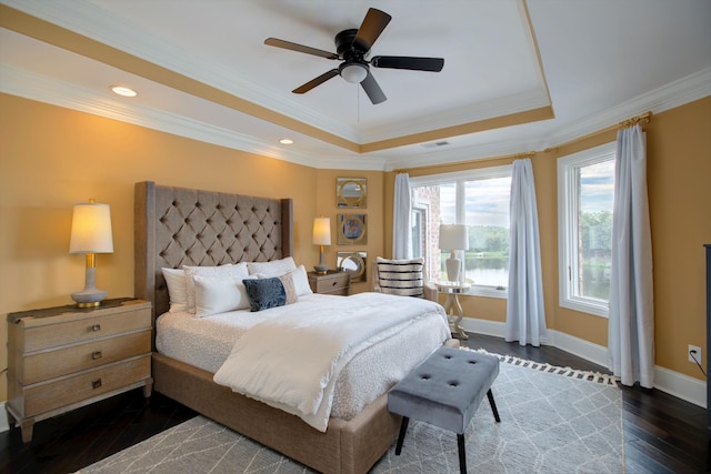 140 Lake Shore Ln, Henderson, TN 38340 - bedroom featuring wood finished floors, baseboards, visible vents, a raised ceiling, and crown molding