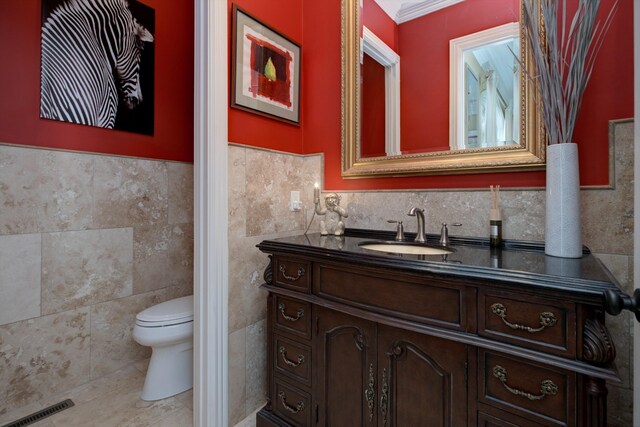 140 Lake Shore Ln, Henderson, TN 38340 - bathroom featuring tile walls, visible vents, toilet, and vanity