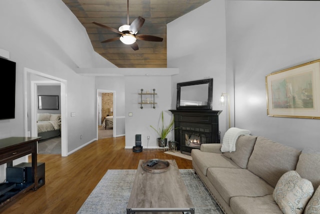 2561 Edinburgh St, Old Hickory, TN 37138 - living area with ceiling fan, high vaulted ceiling, baseboards, a fireplace with flush hearth, and wood finished floors