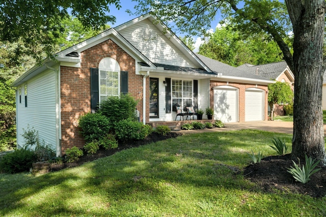 2561 Edinburgh St, Old Hickory, TN 37138 - view of front facade with an attached garage, a front yard, and brick siding