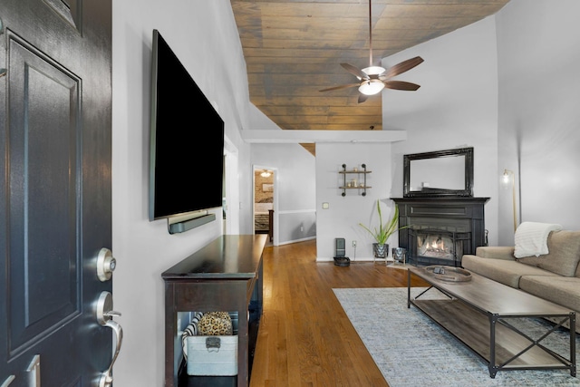 2561 Edinburgh St, Old Hickory, TN 37138 - living area featuring wood finished floors, baseboards, a lit fireplace, wood ceiling, and a ceiling fan