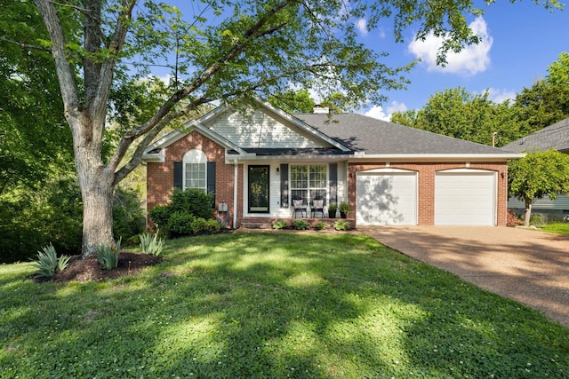 2561 Edinburgh St, Old Hickory, TN 37138 - view of front of house featuring brick siding, an attached garage, driveway, and a front yard