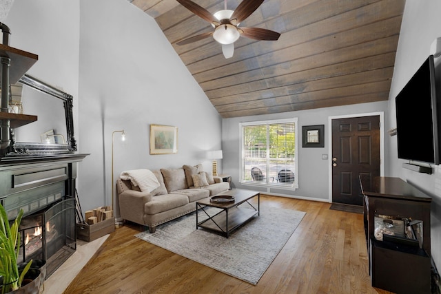 2561 Edinburgh St, Old Hickory, TN 37138 - living area featuring wood finished floors, ceiling fan, a warm lit fireplace, high vaulted ceiling, and wood ceiling