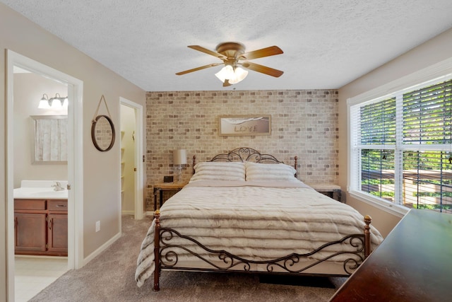 2561 Edinburgh St, Old Hickory, TN 37138 - bedroom with light colored carpet, a sink, a textured ceiling, and brick wall