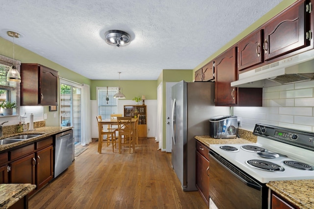 2561 Edinburgh St, Old Hickory, TN 37138 - kitchen featuring stainless steel dishwasher, dark wood-type flooring, electric range oven, under cabinet range hood, and decorative light fixtures