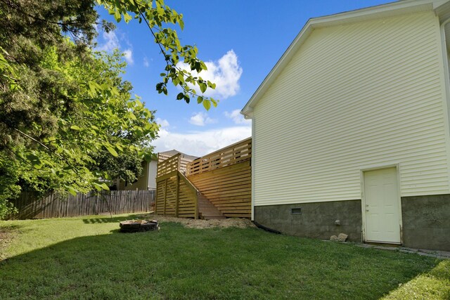2561 Edinburgh St, Old Hickory, TN 37138 - view of side of property with an outdoor fire pit, fence, a yard, and crawl space