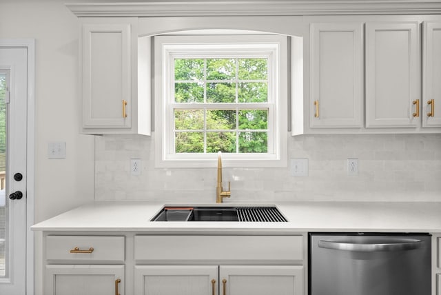 kitchen featuring white cabinetry, decorative backsplash, a sink, light countertops, and dishwasher