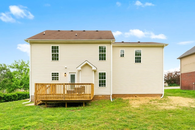 back of house featuring a deck and a yard