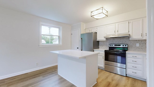 kitchen with light wood-style flooring, appliances with stainless steel finishes, under cabinet range hood, and white cabinetry