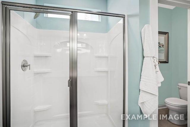 full bathroom with toilet and a shower stall