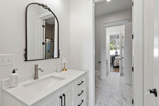 ensuite bathroom with ensuite bath, vanity, toilet, marble finish floor, and a stall shower