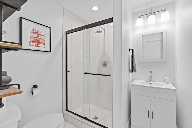 full bathroom with recessed lighting, vanity, a stall shower, and toilet