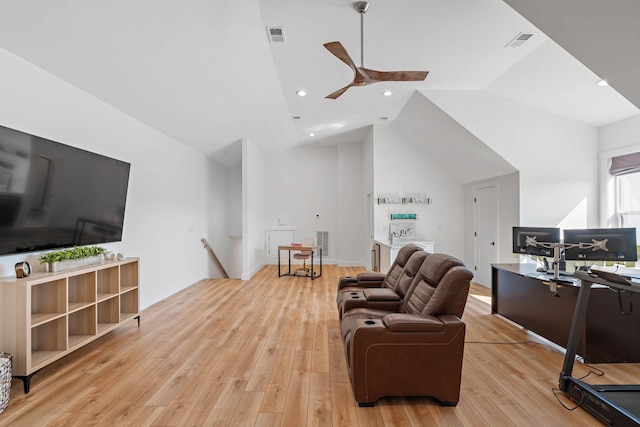 living room with a ceiling fan, visible vents, lofted ceiling, and light wood-style floors