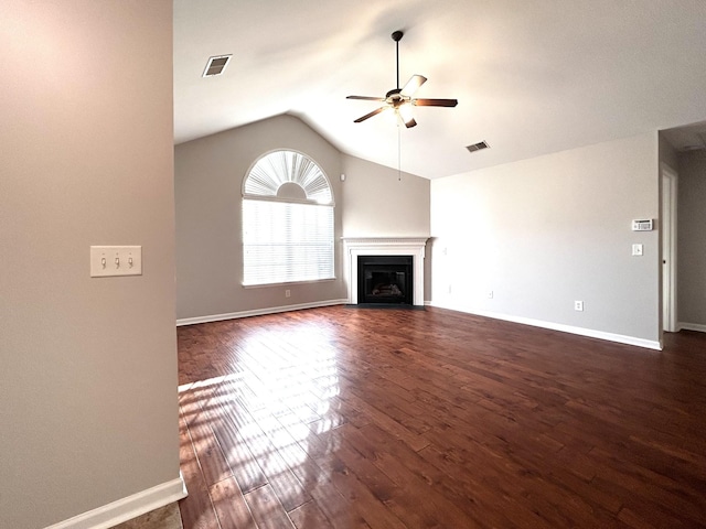 unfurnished living room featuring dark wood-type flooring, visible vents, a ceiling fan, and lofted ceiling