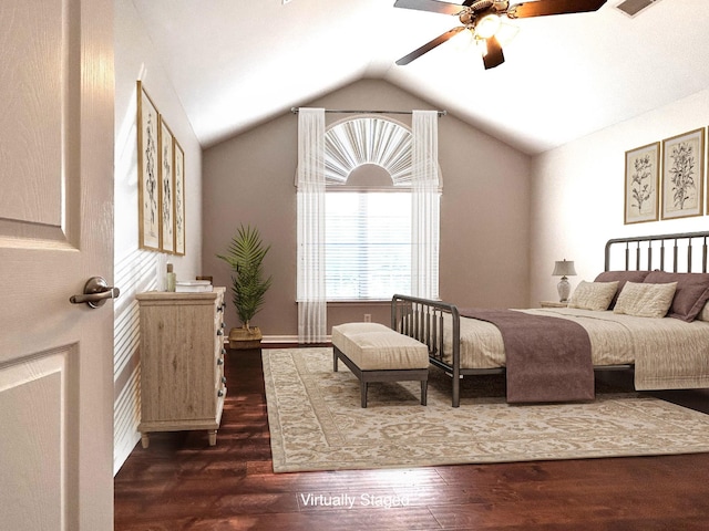 bedroom featuring dark wood-style floors, a ceiling fan, and vaulted ceiling