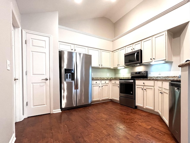 kitchen with appliances with stainless steel finishes, dark wood-type flooring, dark stone counters, and high vaulted ceiling