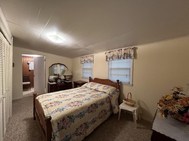 bedroom with baseboards, carpet, and ensuite bathroom