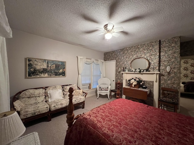 bedroom featuring a textured ceiling, ceiling fan, and carpet