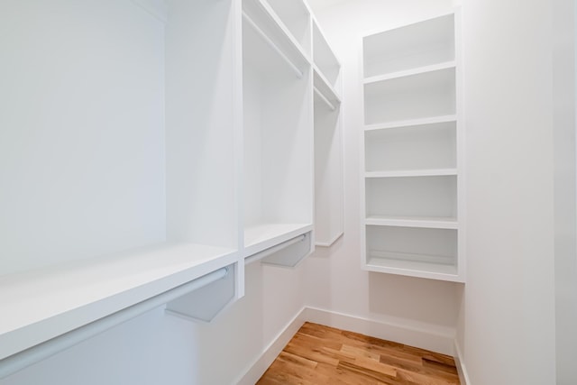 walk in closet featuring light wood finished floors