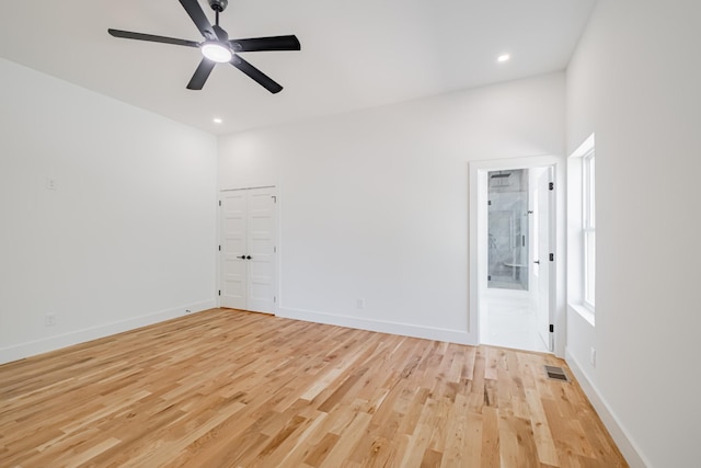 unfurnished room with recessed lighting, light wood-style flooring, baseboards, visible vents, and a ceiling fan