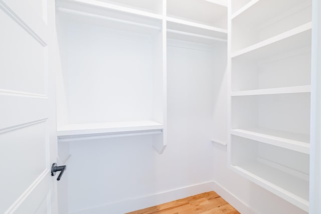 spacious closet with light wood finished floors