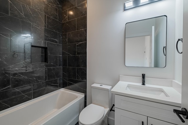 bathroom featuring vanity, toilet, and  shower combination