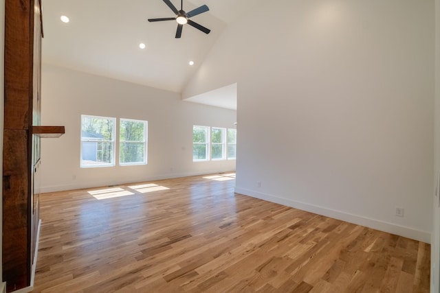 unfurnished living room featuring ceiling fan, light wood-type flooring, recessed lighting, and high vaulted ceiling