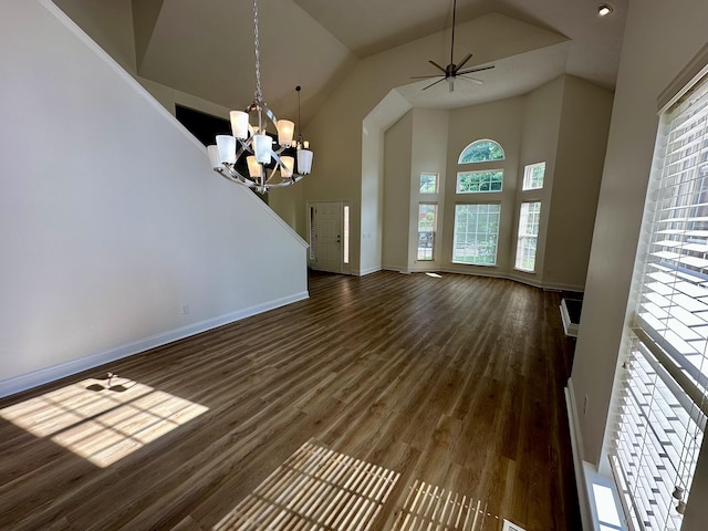 interior space featuring a healthy amount of sunlight, high vaulted ceiling, and dark wood-style floors